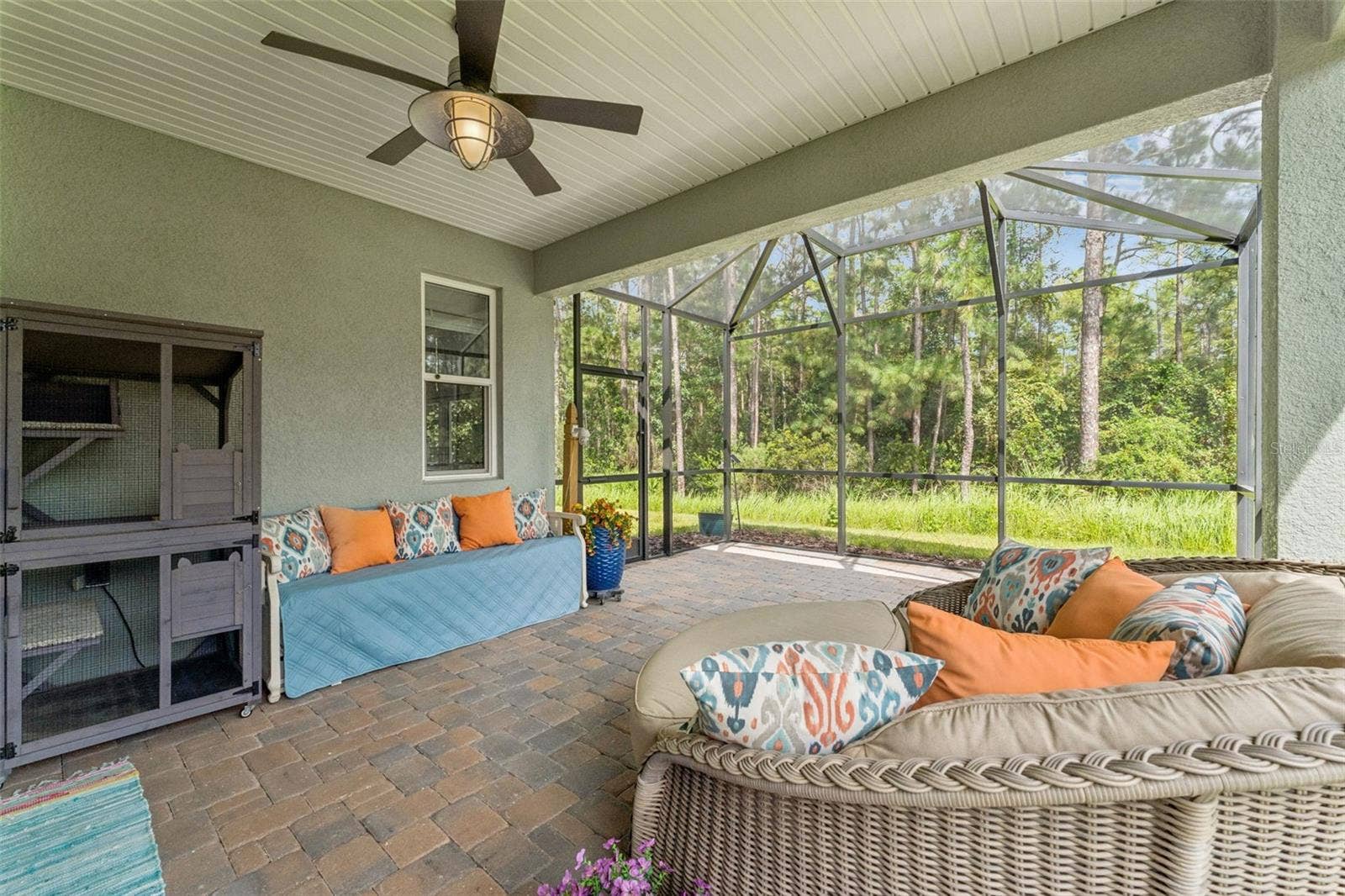 1305 HAYTON AVE., Deland, FL 32724 15' x 22' Screen enclosed covered patio w/ brick pavers & a conservation area view