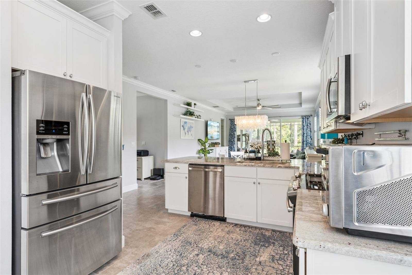 1305 HAYTON AVE., Deland, FL 32724 Kitchen w/ a French door style refrigerator & all stainless steel appliances