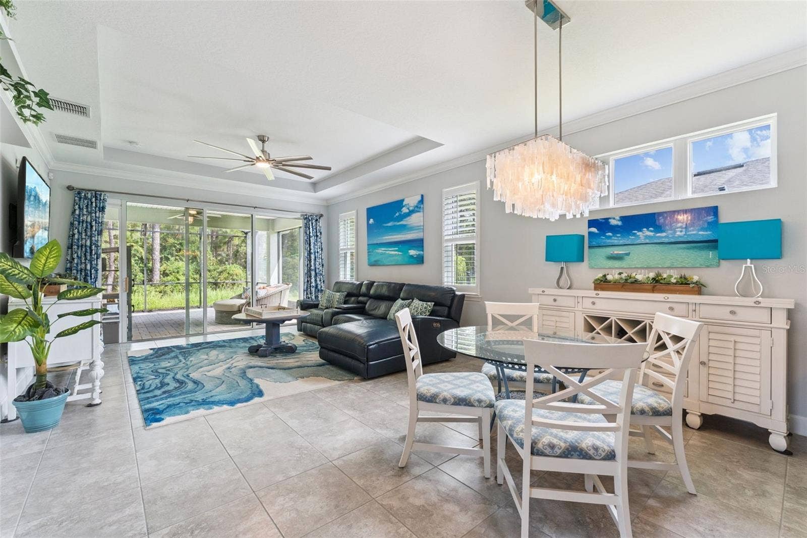 1305 HAYTON AVE., Deland, FL 32724 View of the Dining & Great Room areas w/ crown molding, tray ceiling & a ceiling fan
