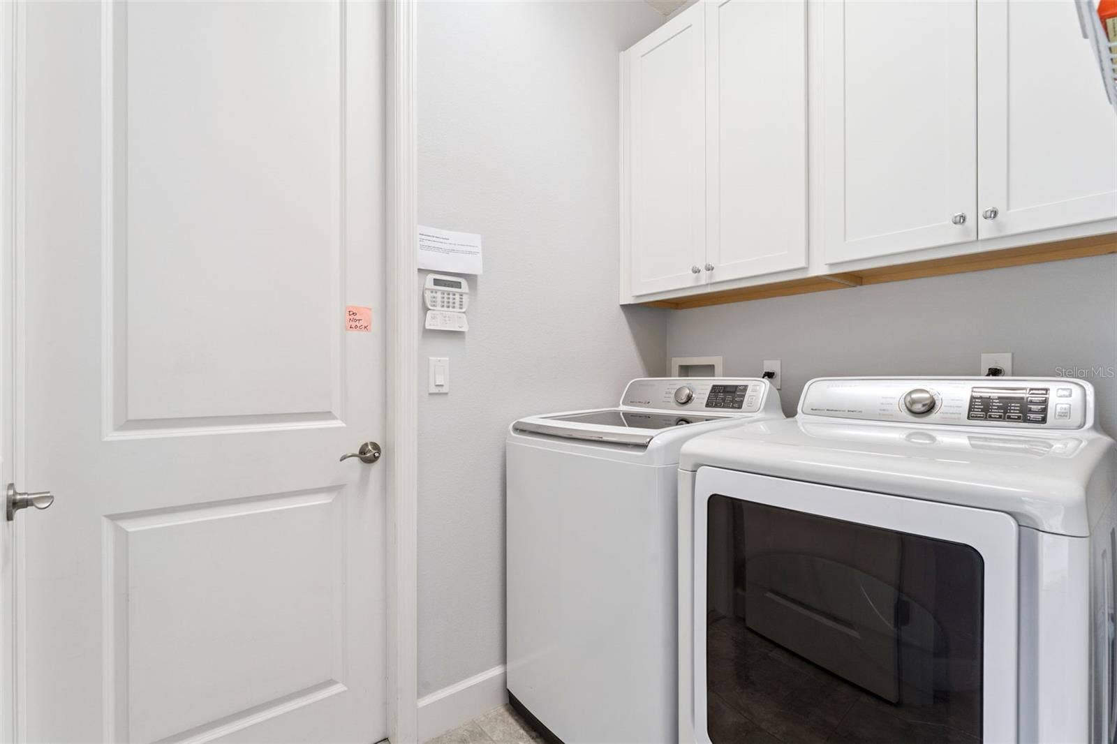 1305 HAYTON AVE., Deland, FL 32724 7' x 5'6" Utility Room w/ washer, natural gas dryer & storage cabinets