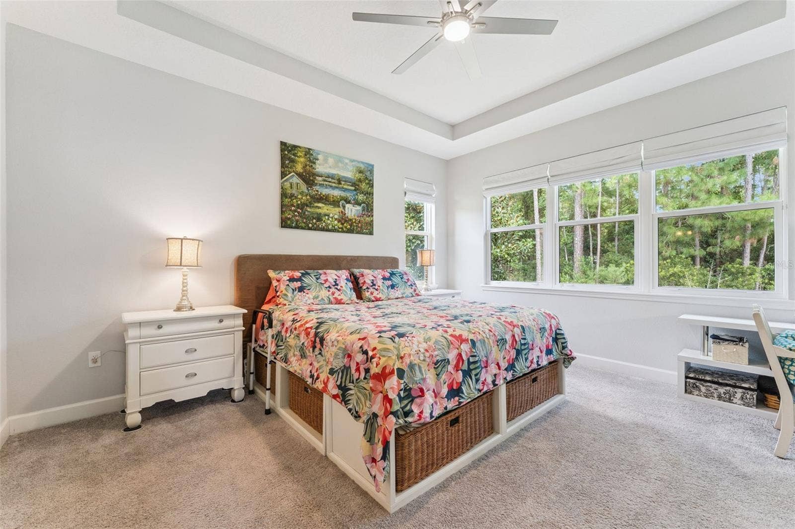 1305 HAYTON AVE., Deland, FL 32724 13' x 15' Primary Bedroom w/ tray ceiling, ceiling fan, pull-down shades & a conservation area view
