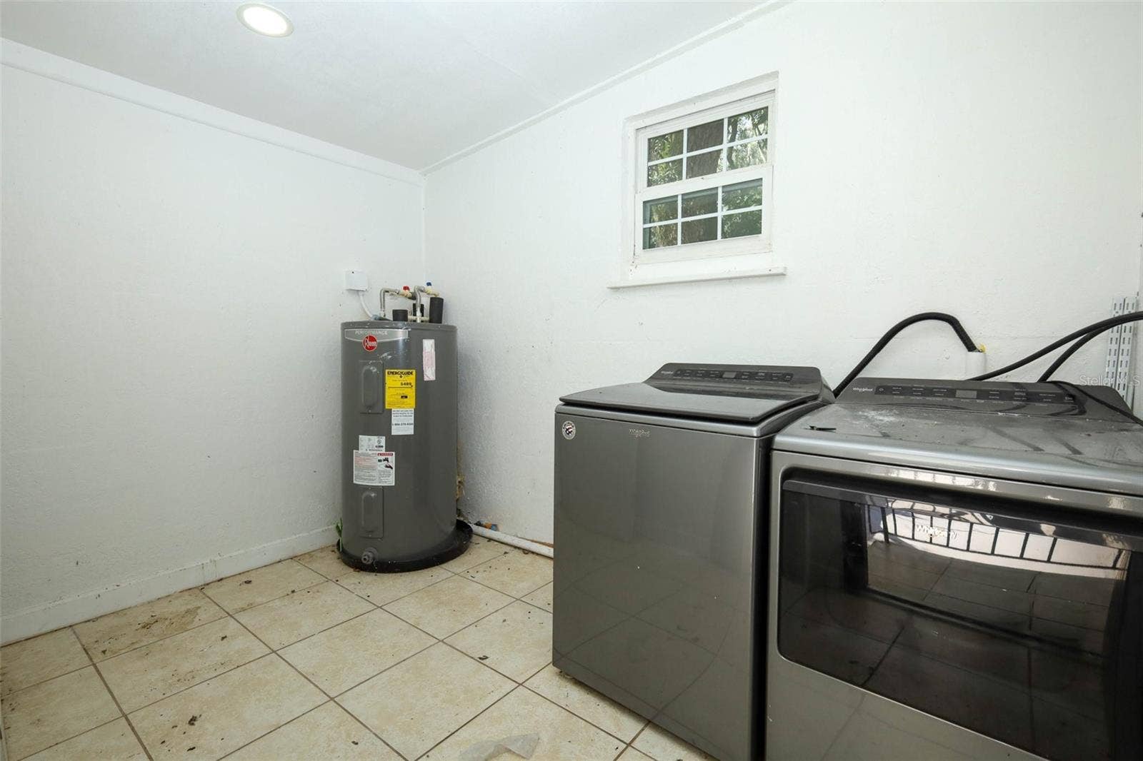 7614 BELL BOULEVARD, Orlando, FL 32810 utility room behind carport
