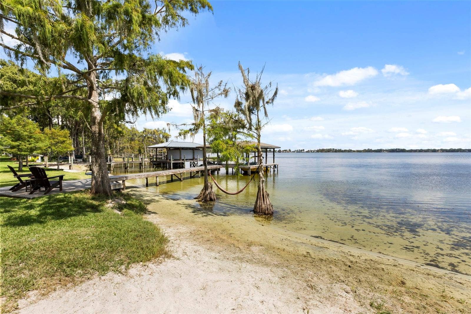 10430 LAKE COTTAGE LANE, Orlando, FL 32836 Rare Lake Sheen lakefront estate opportunity on the Butler Chain of Lakes! An exceptional opportunity to build a custom luxury lakefront residence on one of the most compelling properties along Lake Cottage Lane.