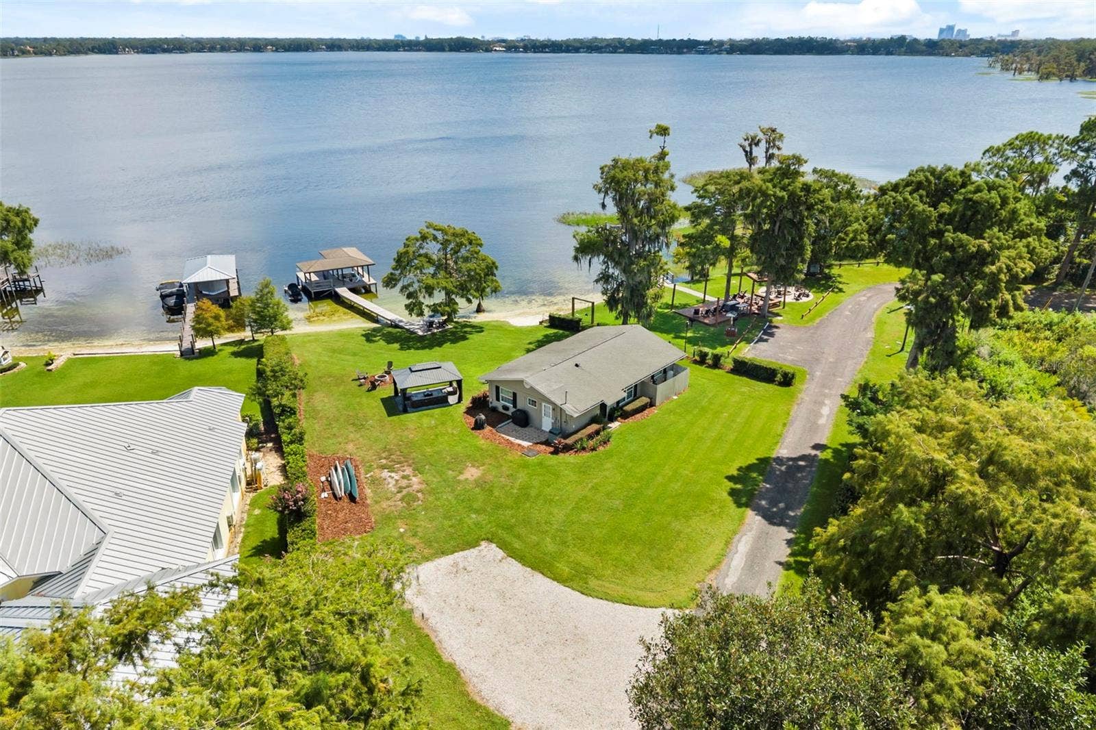 10430 LAKE COTTAGE LANE, Orlando, FL 32836 Rare Lake Sheen lakefront estate opportunity on the Butler Chain of Lakes! An exceptional opportunity to build a custom luxury lakefront residence on one of the most compelling properties along Lake Cottage Lane.