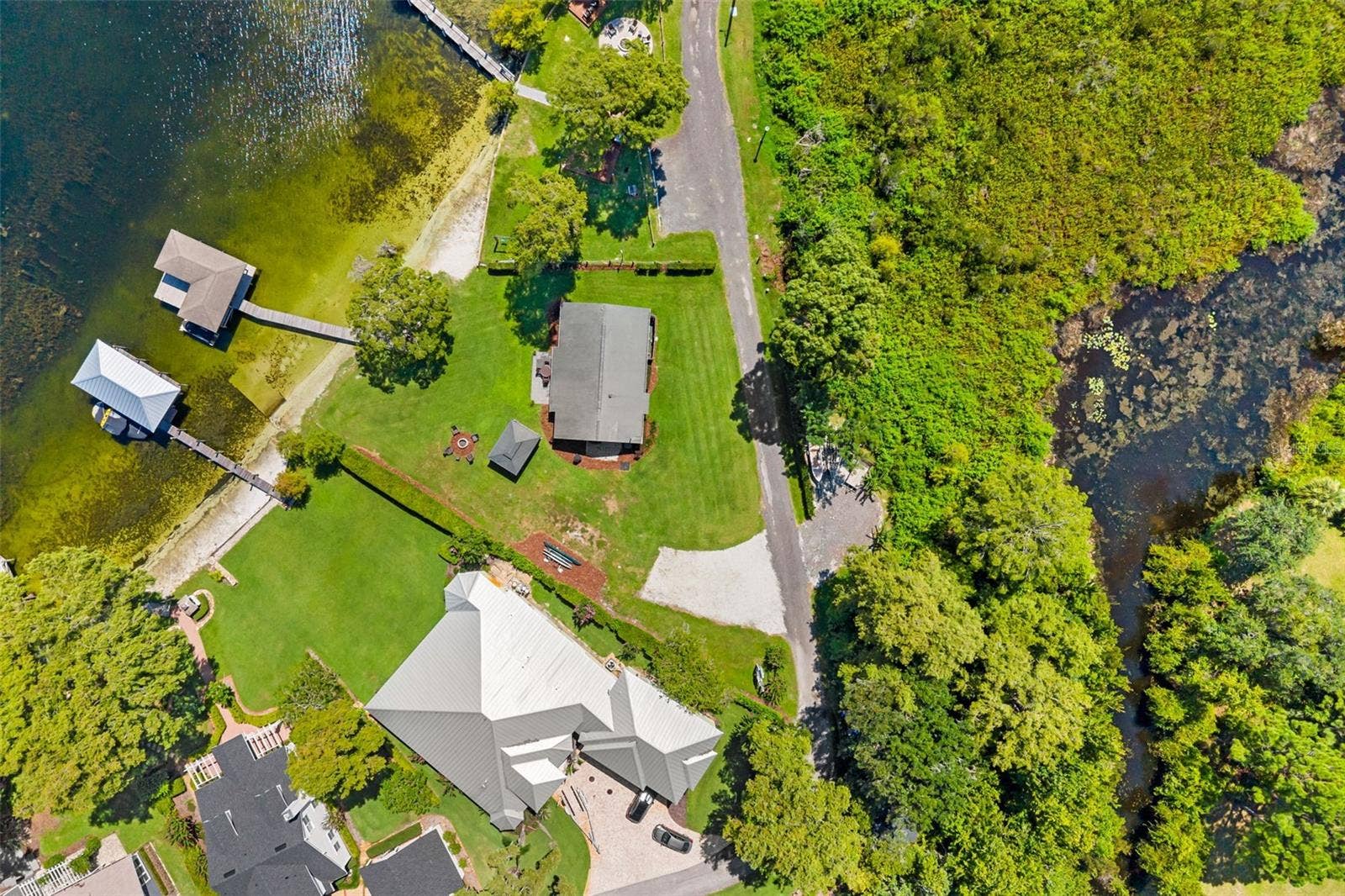 10430 LAKE COTTAGE LANE, Orlando, FL 32836 Rare Lake Sheen lakefront estate opportunity on the Butler Chain of Lakes! An exceptional opportunity to build a custom luxury lakefront residence on one of the most compelling properties along Lake Cottage Lane.