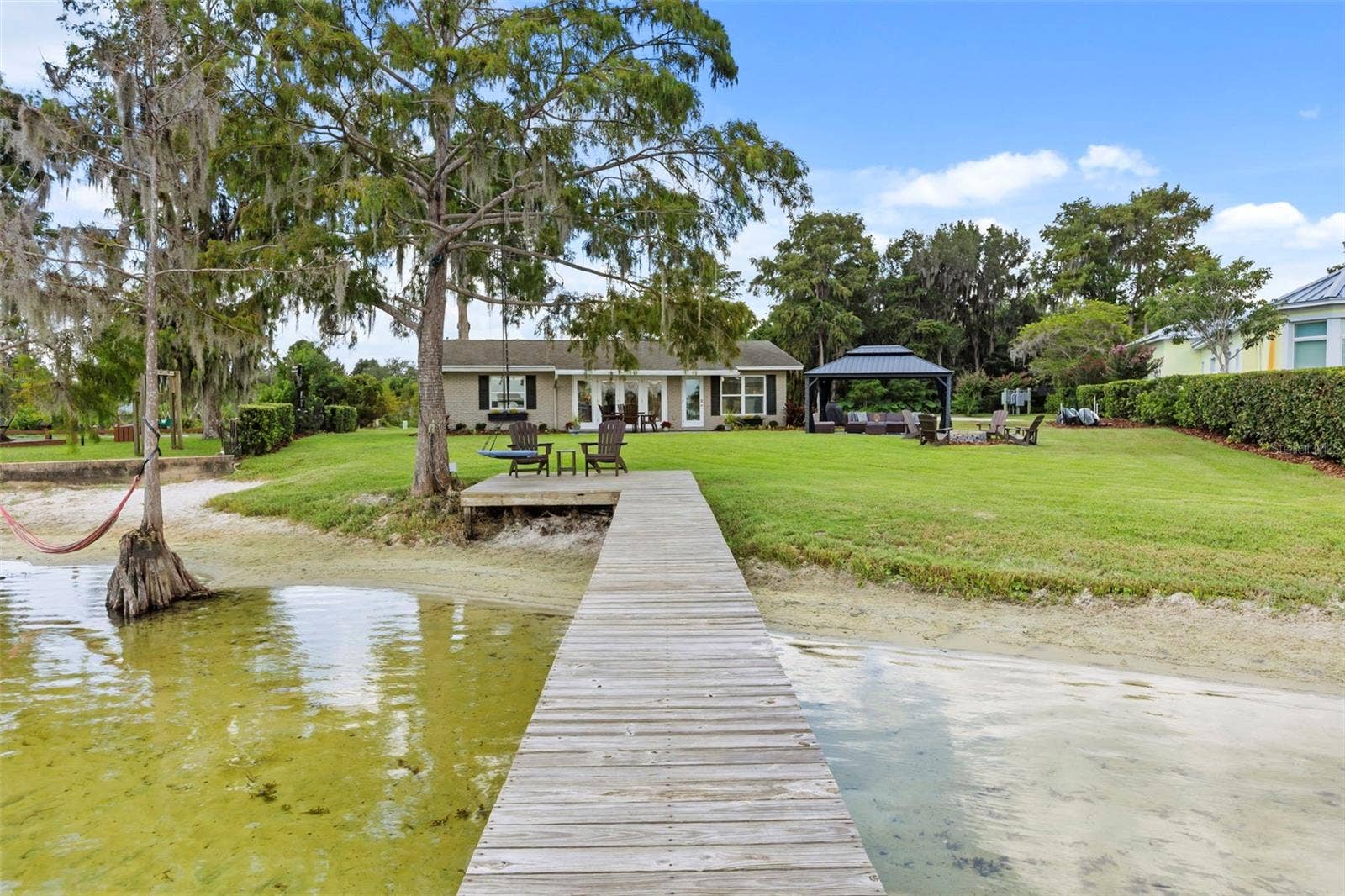10430 LAKE COTTAGE LANE, Orlando, FL 32836 Rare Lake Sheen lakefront estate opportunity on the Butler Chain of Lakes! An exceptional opportunity to build a custom luxury lakefront residence on one of the most compelling properties along Lake Cottage Lane.