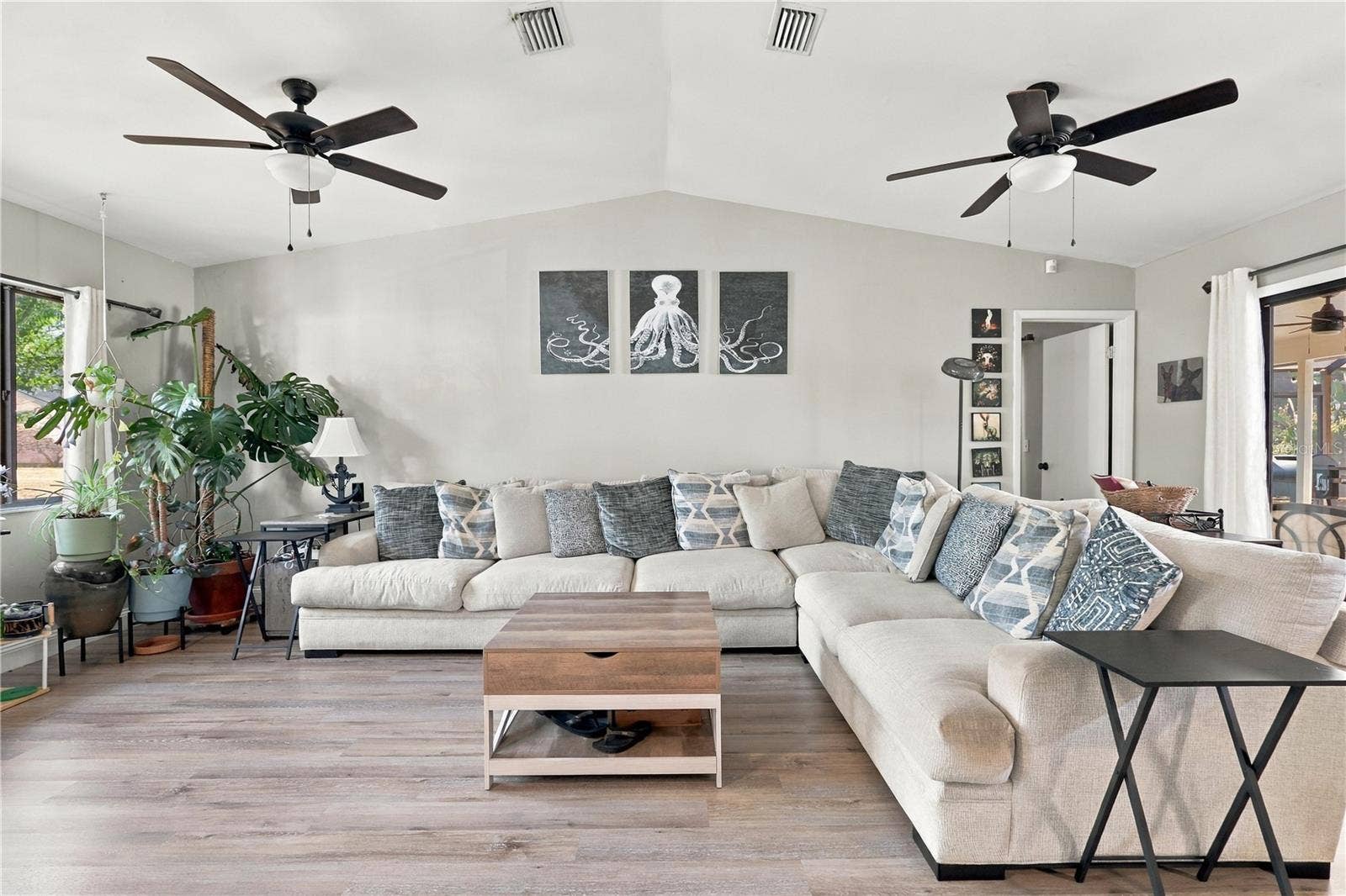 Beautiful, Open Living Room, Vaulted Ceilings, Double Ceiling Fans & Sliding Glass Door to the Pool, Spa & Lanai.