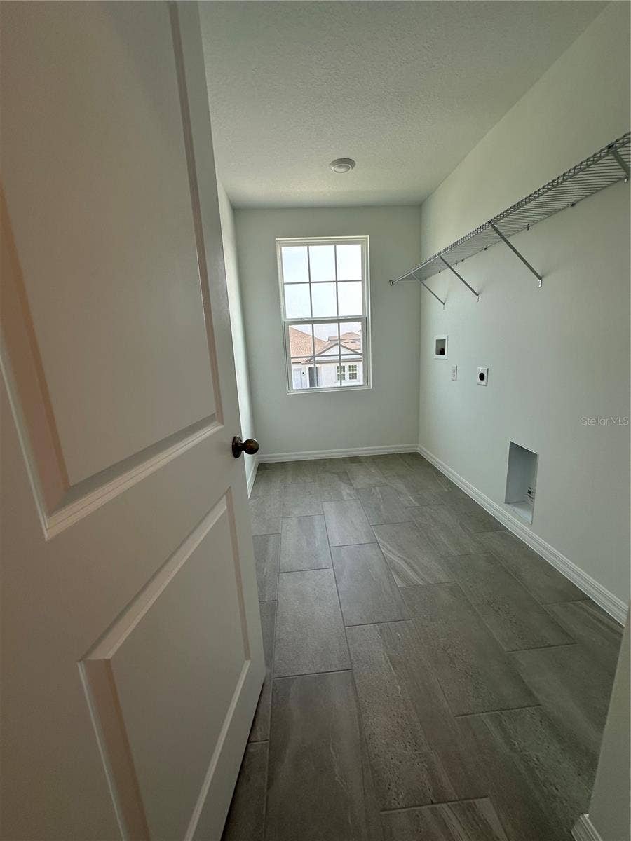5714 CATTLE RANCH DRIVE, St Cloud, FL 34771 For ultimate comfort and convenience, this beautiful home includes a washer and dryer, thoughtfully located on the second floor for easy access to the bedrooms, making everyday laundry effortless!