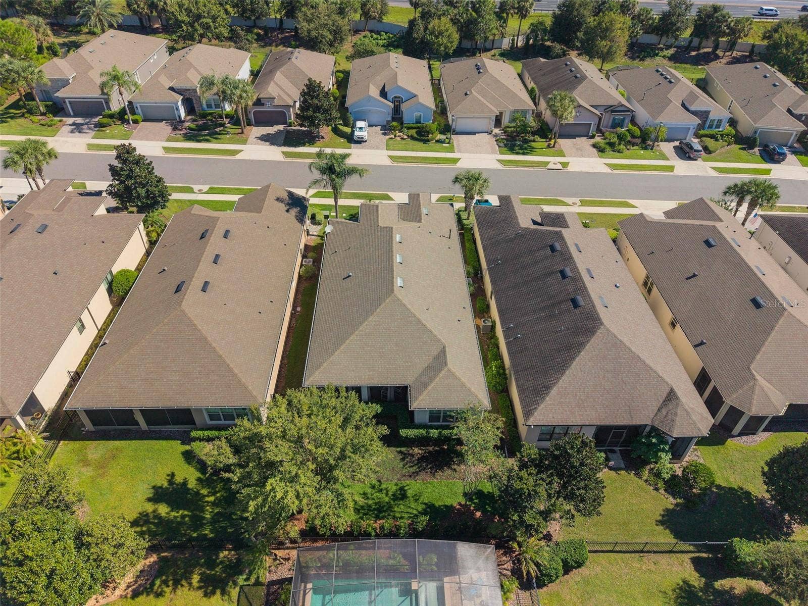 1038 TIMBERVALE TRAIL, Clermont, FL 34715 Drone view of the rear of the home