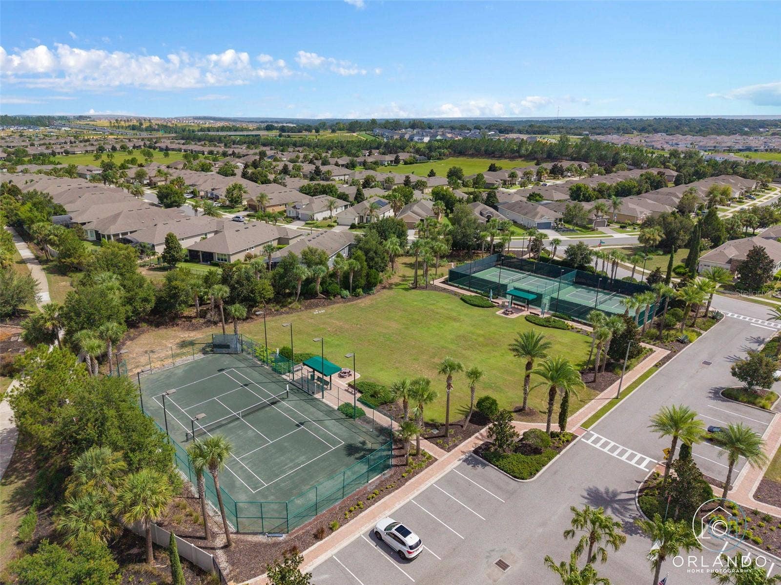 1038 TIMBERVALE TRAIL, Clermont, FL 34715 Clay Tennis Court. The Court is lighted for nighttime play.