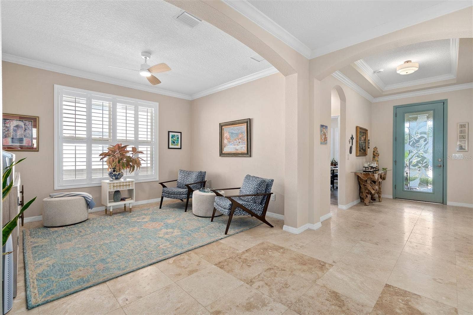 1038 TIMBERVALE TRAIL, Clermont, FL 34715 Flex space can be utilized as an Office/Den/Study or a Sitting Room. The Foyer is in the background.