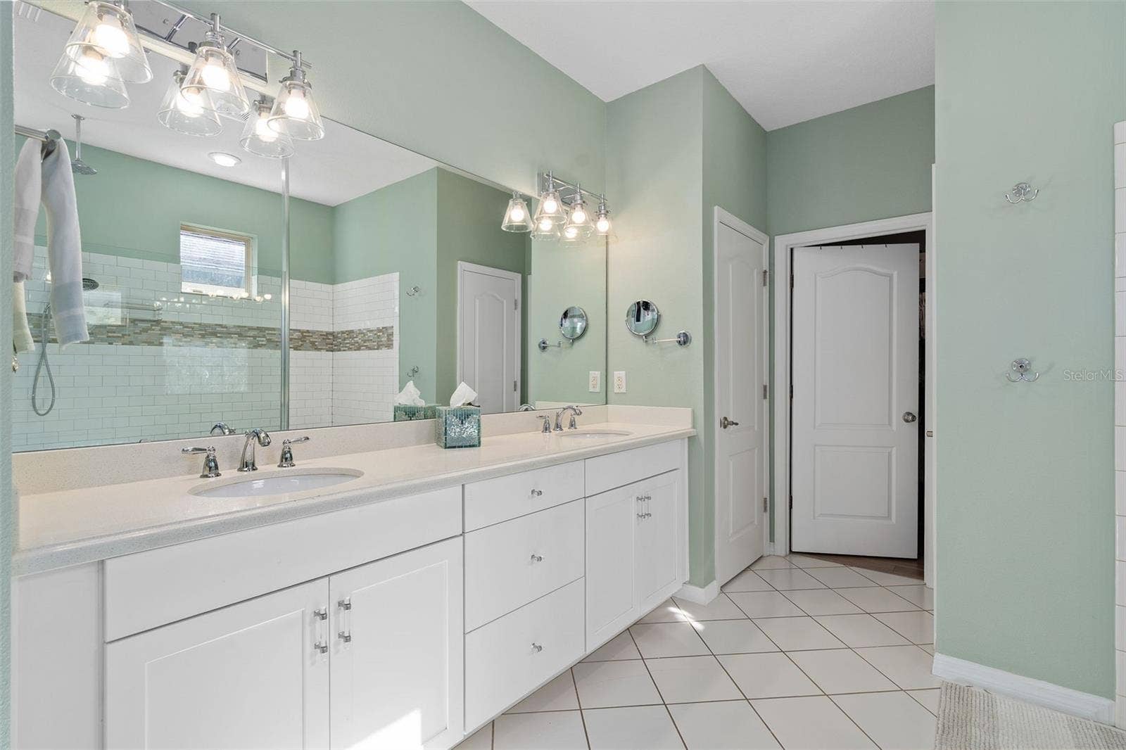1038 TIMBERVALE TRAIL, Clermont, FL 34715 The Primary En-Suite Comfort Height Vanity offers additional center drawers for storage