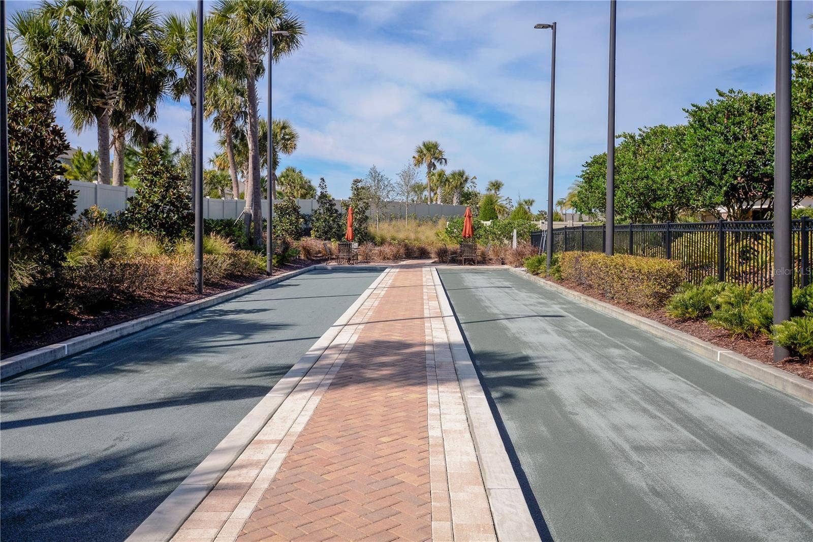 1038 TIMBERVALE TRAIL, Clermont, FL 34715 Clay Bocce' Courts. The Courts are lighted for nighttime play.