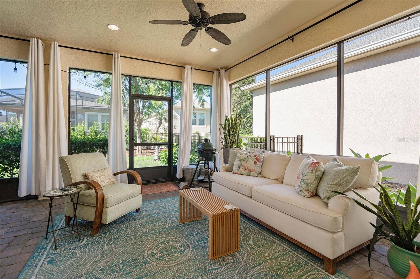 1038 TIMBERVALE TRAIL, Clermont, FL 34715 Enjoy the Screened Lanai with 2 Ceiling Fans and Pavers. There is also a Misting System outside for cooling off