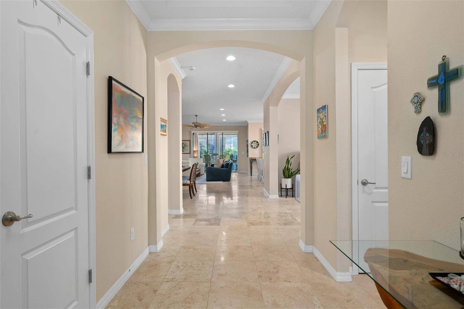 1038 TIMBERVALE TRAIL, Clermont, FL 34715 Upon entry to the Foyer is a beautiful see through floor plan with Travertine Flooring