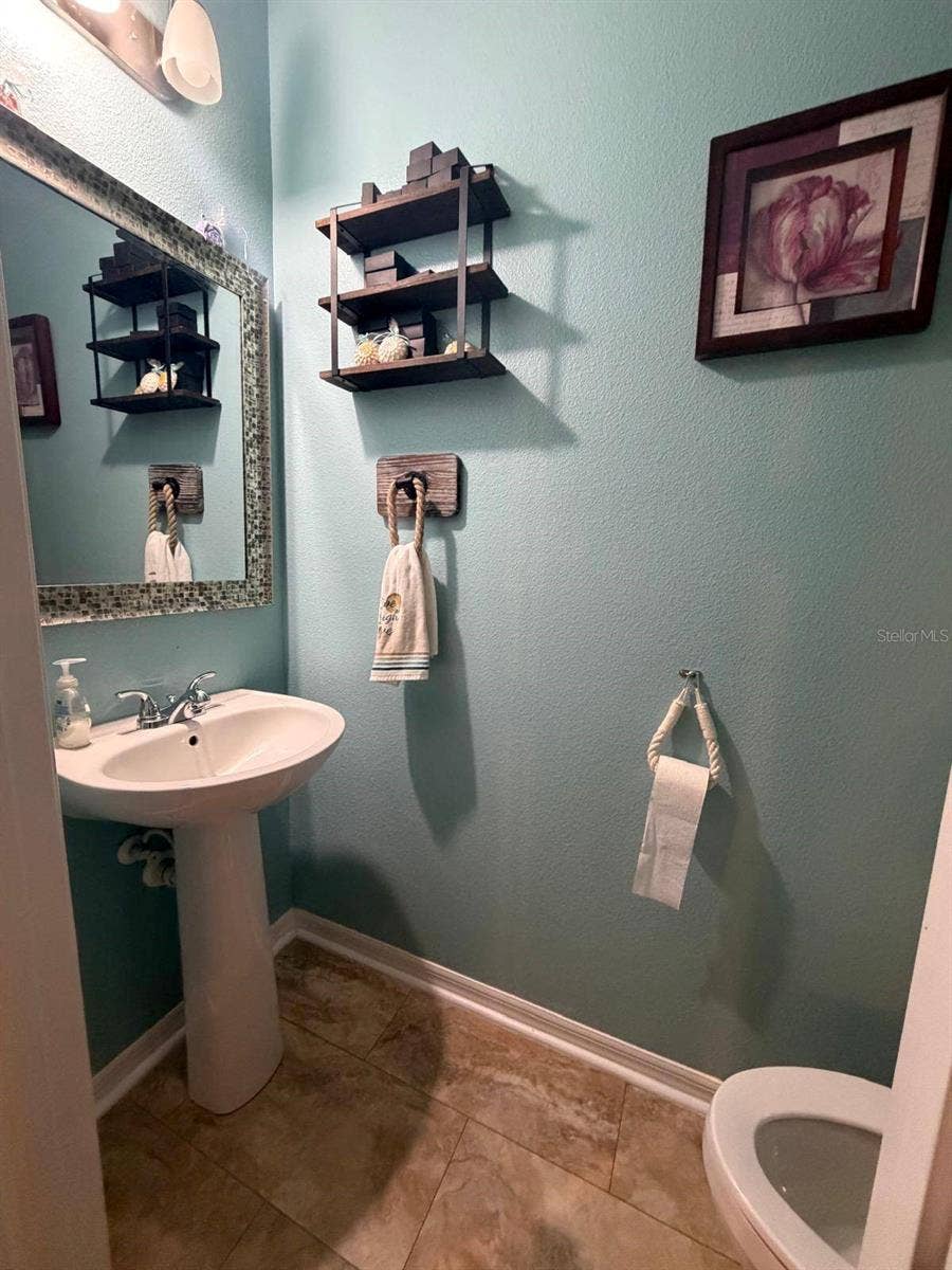 15549 GEMINI DRIVE, Mascotte, FL 34753 half bath by garage