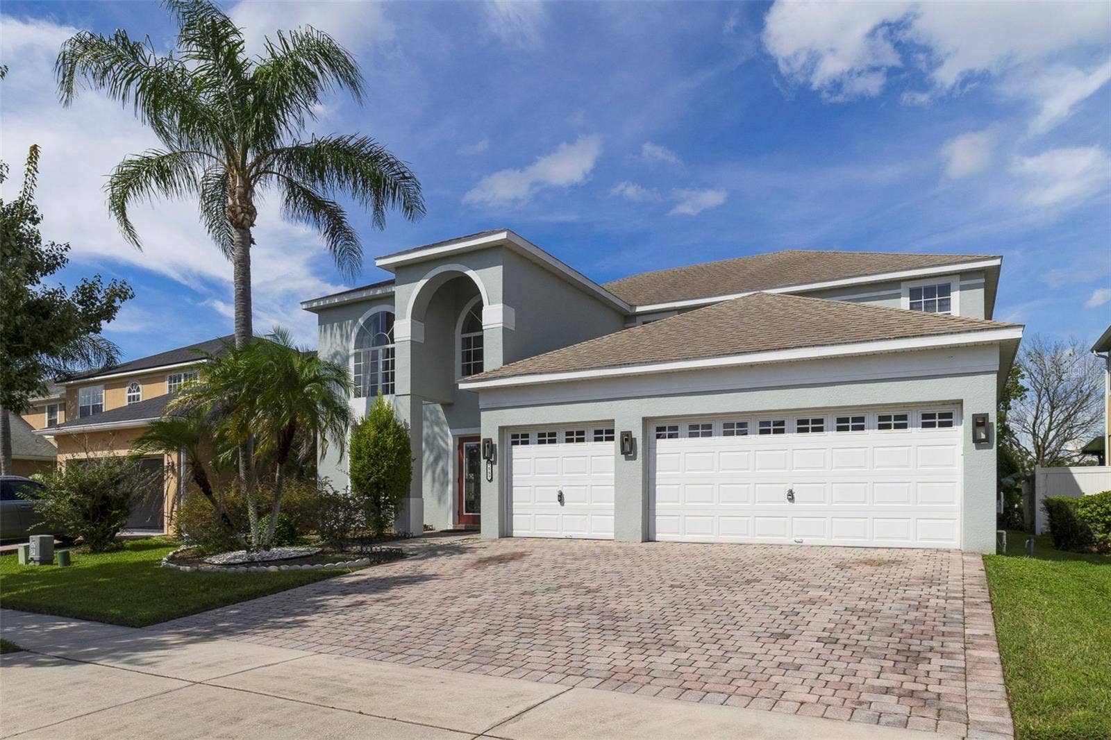 1557 AMARYLLIS CIRCLE, Orlando, FL 32825 With a SCENIC POND VIEW from the front, attractive landscaping and a brick-paver driveway leading to the THREE-CAR GARAGE, this home makes a wonderful first impression.