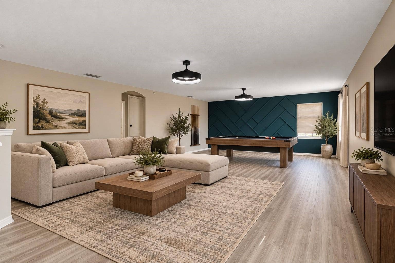 1557 AMARYLLIS CIRCLE, Orlando, FL 32825 Upstairs, a HUGE LOFT with UPDATED LIGHT/FAN FIXTURES and an accent wall, provides valuable flex space for a media room, game room, home office or additional lounge area. Virtually Staged
