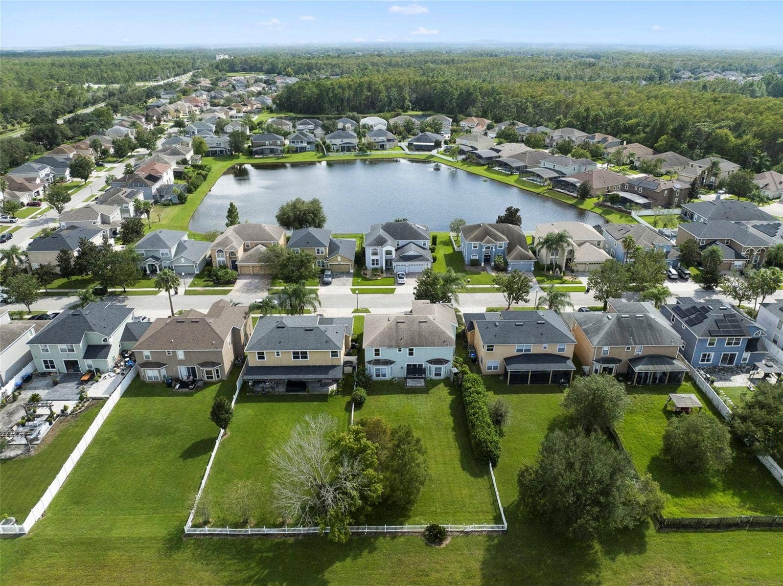 1557 AMARYLLIS CIRCLE, Orlando, FL 32825 Aerial view of the back of the home and community.