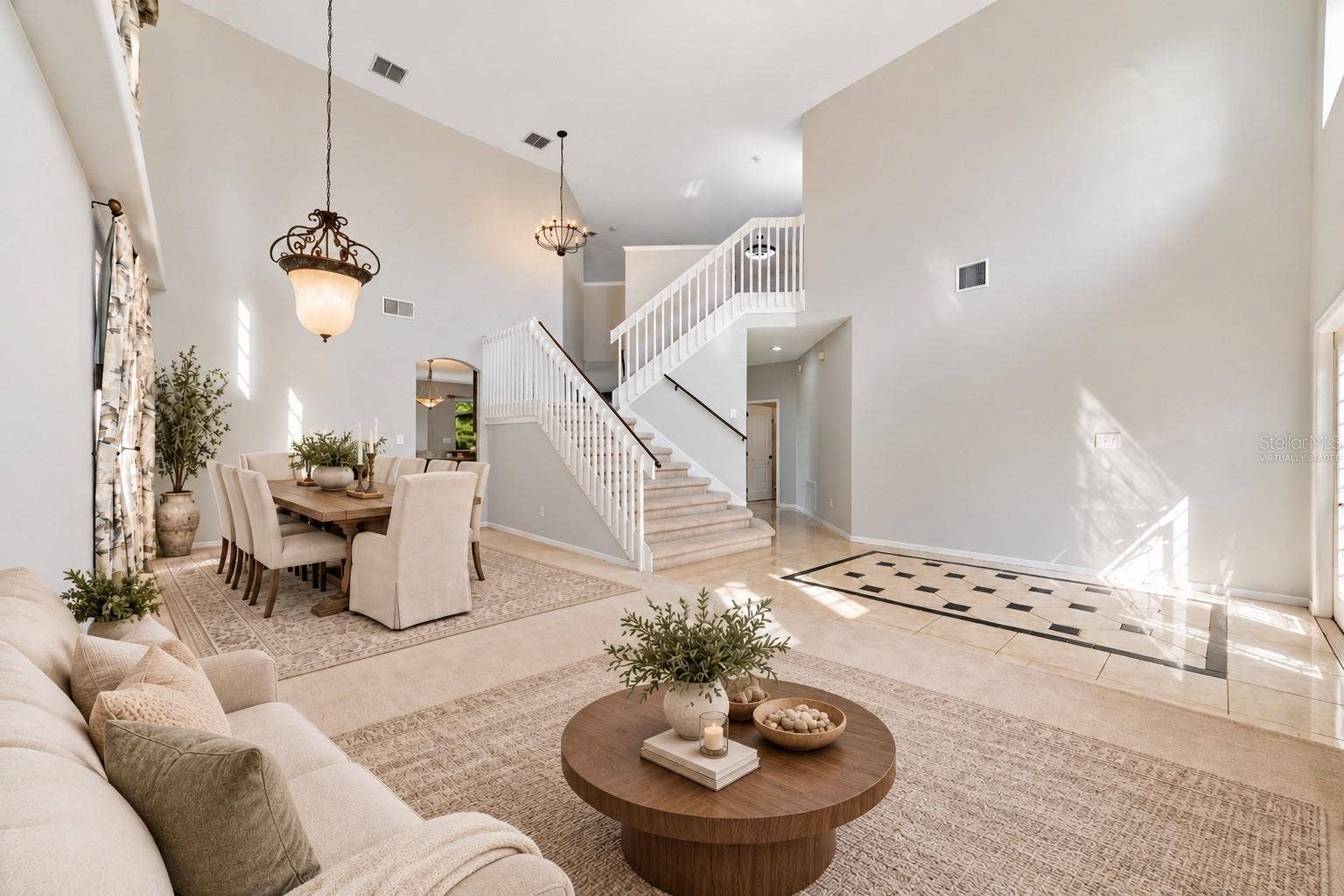 1557 AMARYLLIS CIRCLE, Orlando, FL 32825 The formal LIVING ROOM/DINING ROOM COMBO share an elegant, open setting enhanced by 2-STORY CEILINGS where a chandelier and decorative ceiling medallion create a lovely atmosphere for hosting holidays and special occasions. Virtually Staged