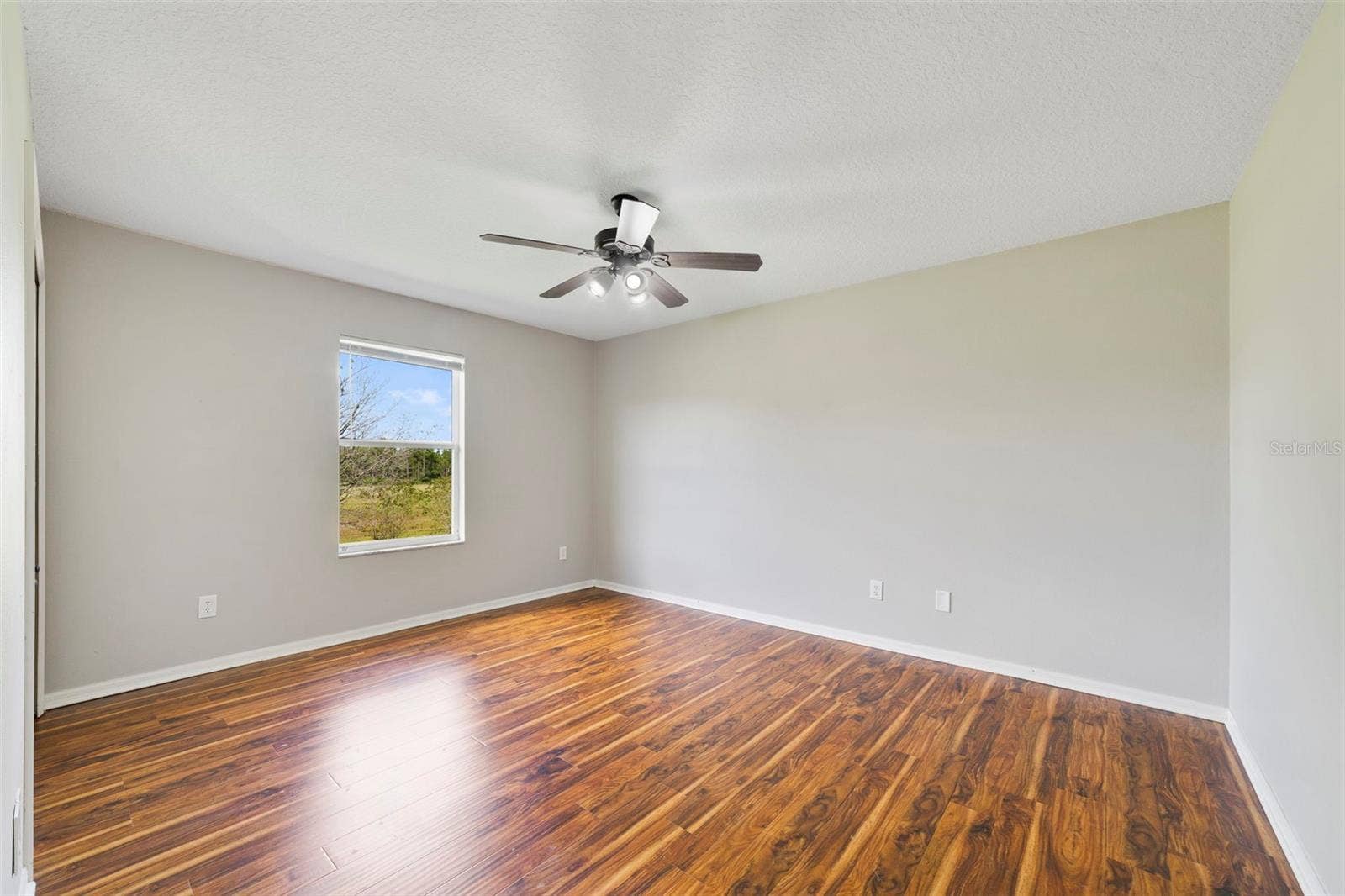 1557 AMARYLLIS CIRCLE, Orlando, FL 32825 LVP FLOORING throughout the second floor creates a cohesive look. Bedroom 4