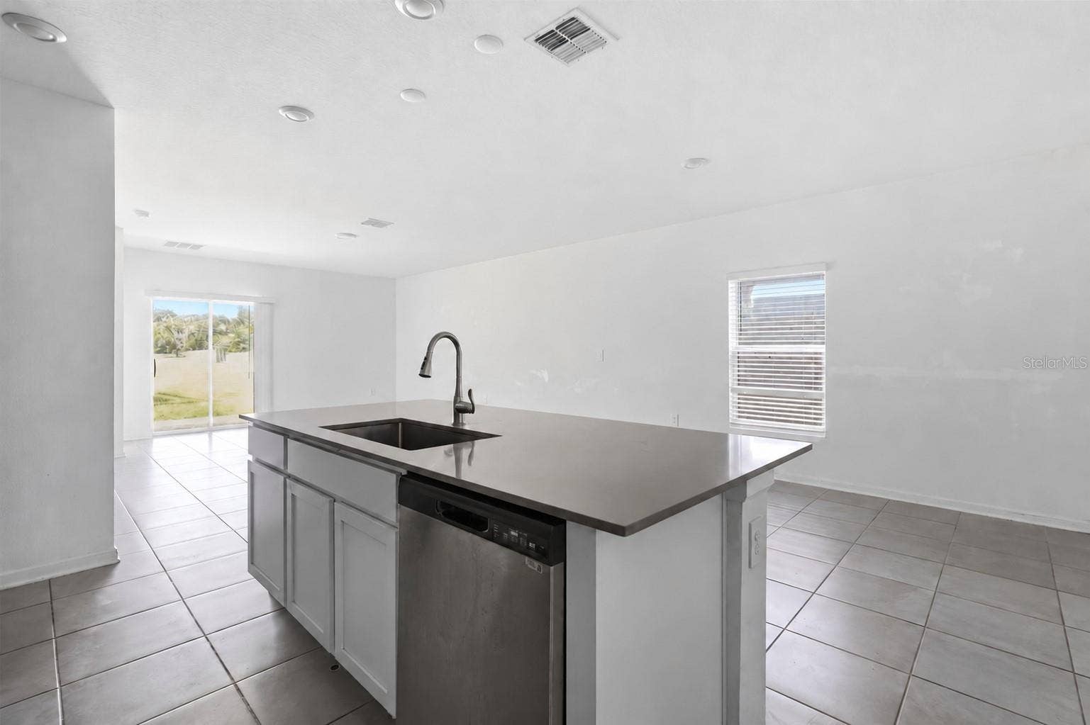 Kitchen comes with an island with stone counters