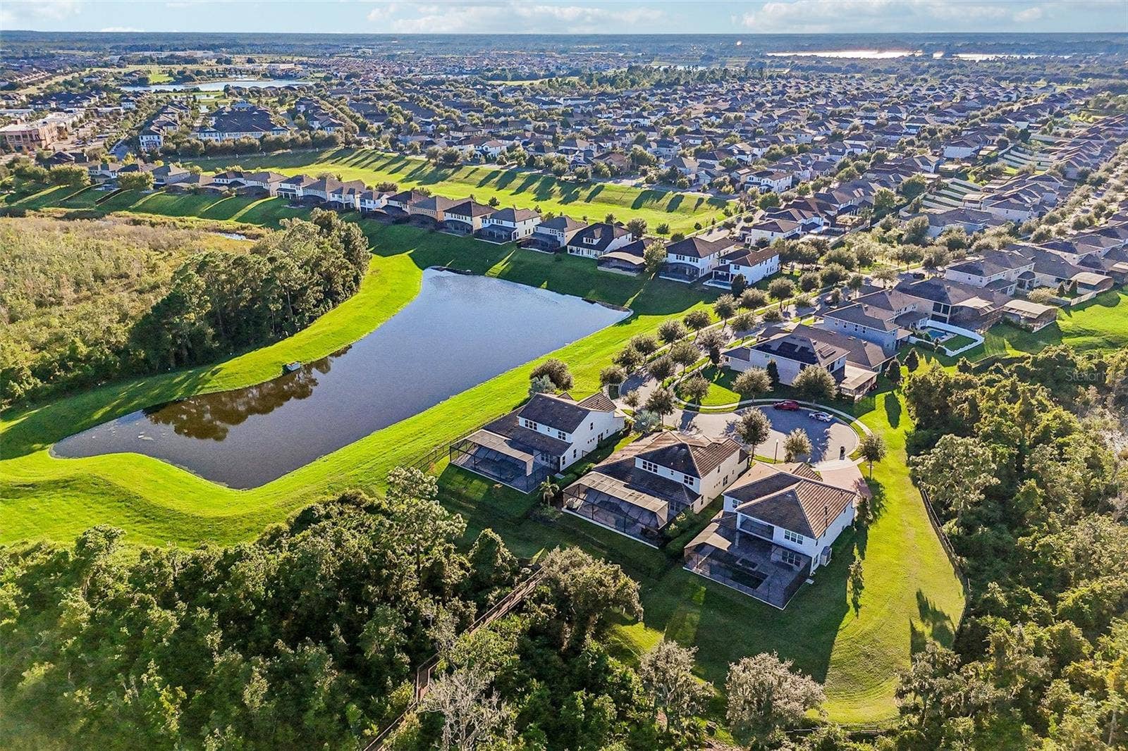 15646 SWEET LEMON WAY, Winter Garden, FL 34787 Mature trees and water views.