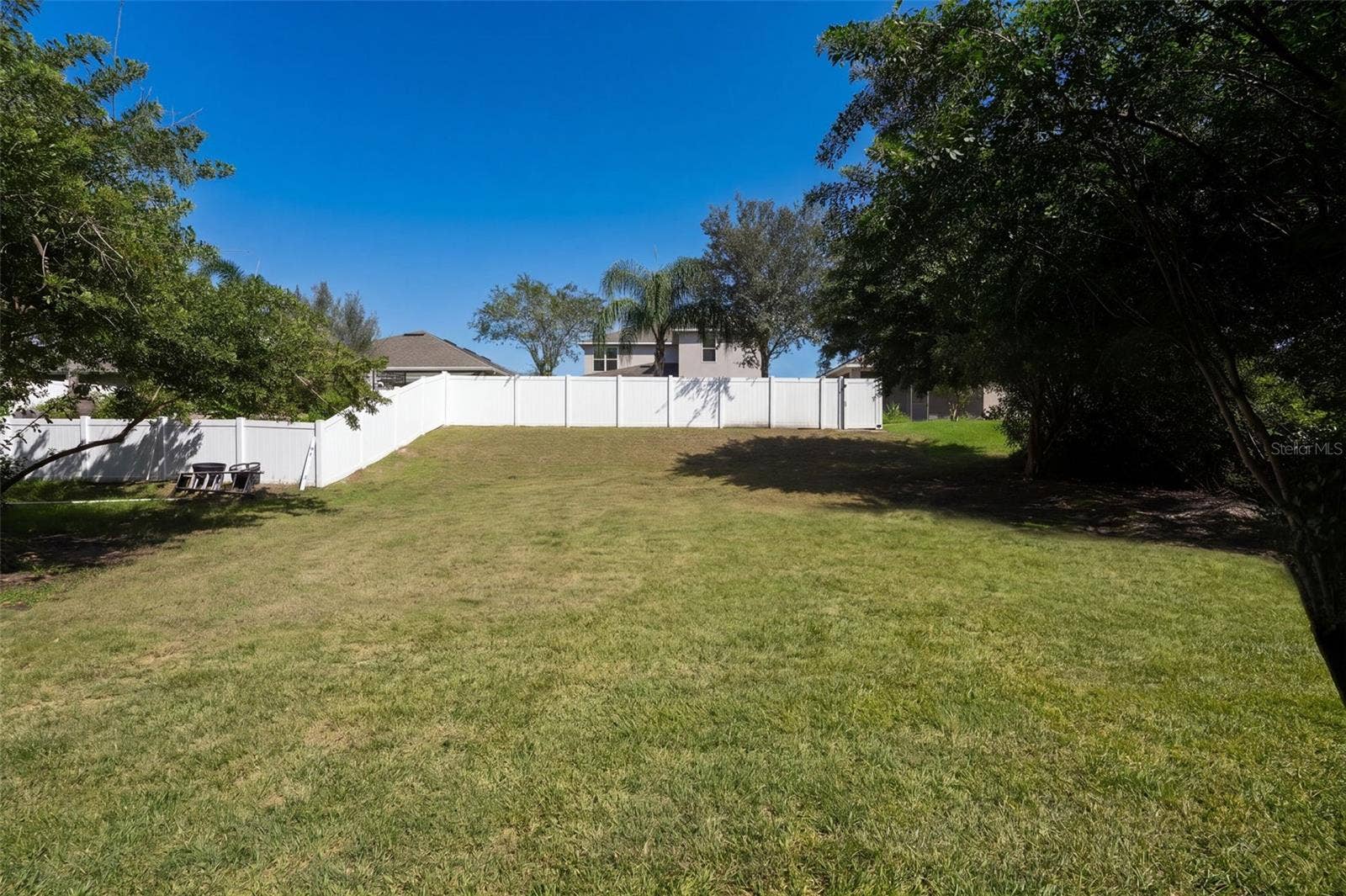 Additional yard space beyond the existing fence