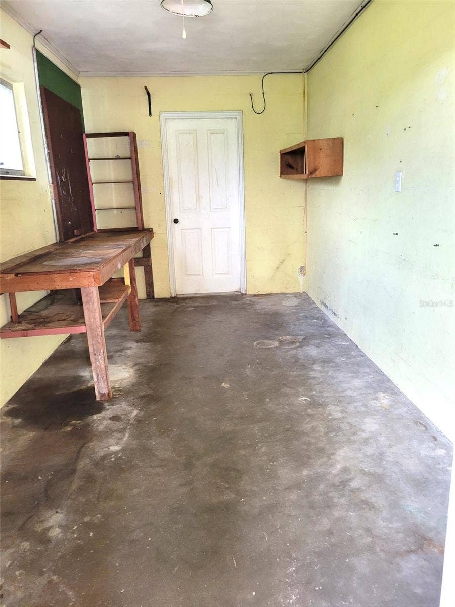 Carport Utility Room/Storage Room with Door and Lock