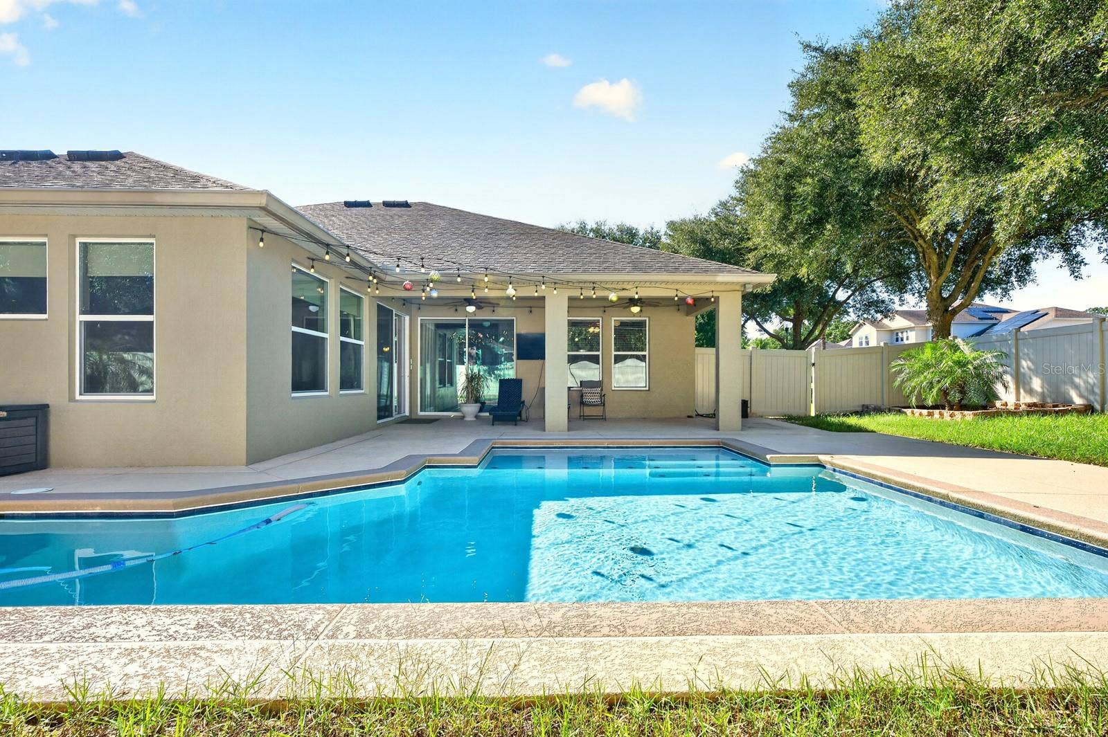 4443 PINE GOLD AVENUE, Apopka, FL 32712 The covered lanai overlooks your private pool and privacy fenced backyard.