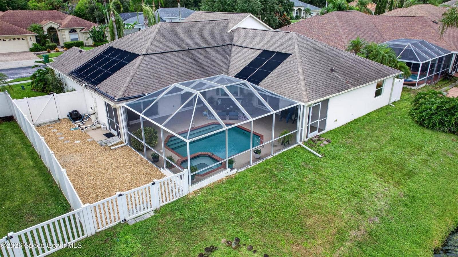 Screened pool, spa, and fenced yard