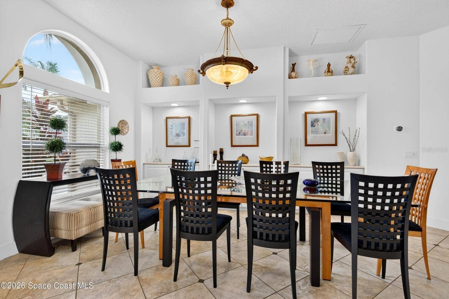 Formal dining with arched window