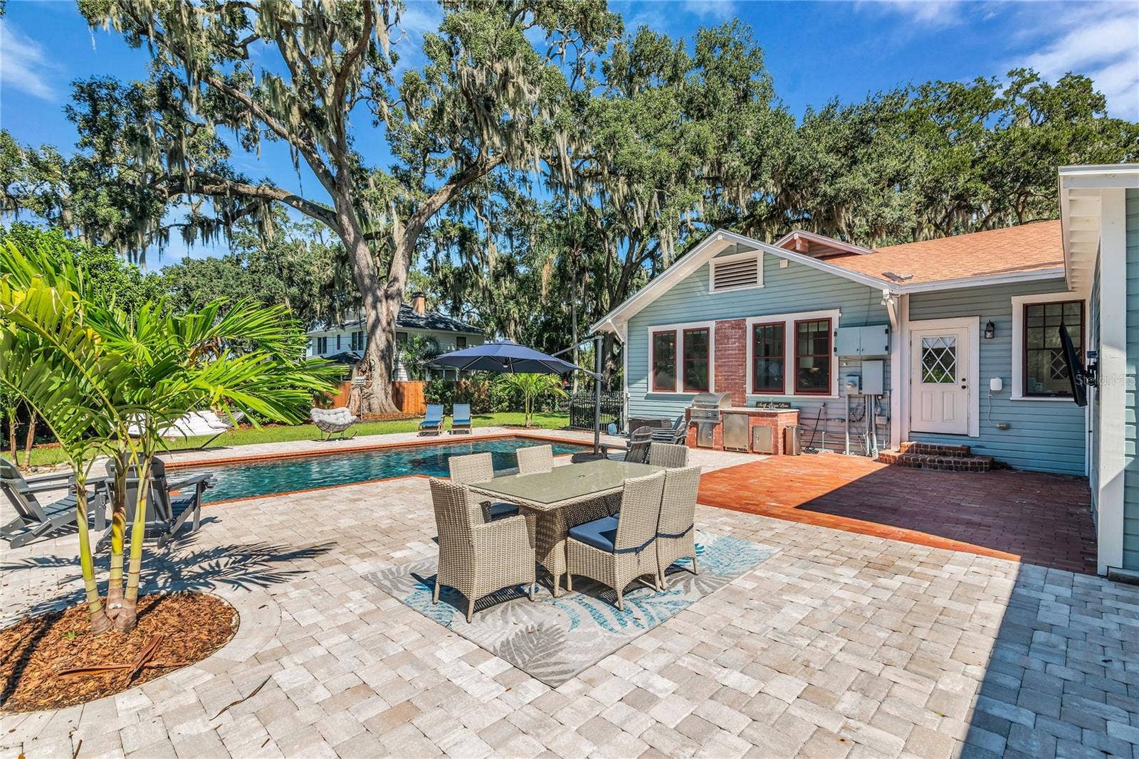 234 N LAKEVIEW AVENUE, Winter Garden, FL 34787 The enormous fully fenced backyard is designed for year-round enjoyment with a gas-heated saltwater sport pool, outdoor kitchen, expansive brick paved deck, detached covered lanai, and low-maintenance turf.