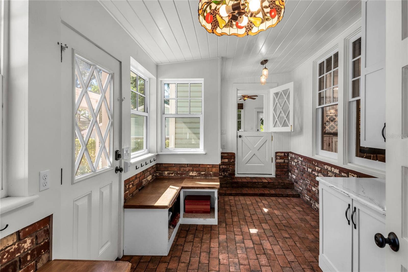 234 N LAKEVIEW AVENUE, Winter Garden, FL 34787 Spacious Mudroom provides entry to carport while a granite countertop, cabinets and a large closet offer both convenience and functionality