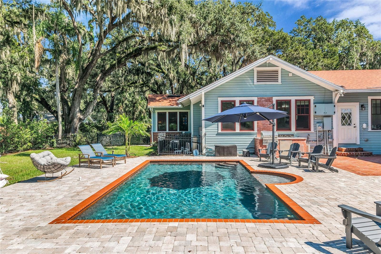 234 N LAKEVIEW AVENUE, Winter Garden, FL 34787 The enormous fully fenced backyard is designed for year-round enjoyment with a gas-heated saltwater sport pool, outdoor kitchen, expansive brick paved deck, detached covered lanai, and low-maintenance turf.