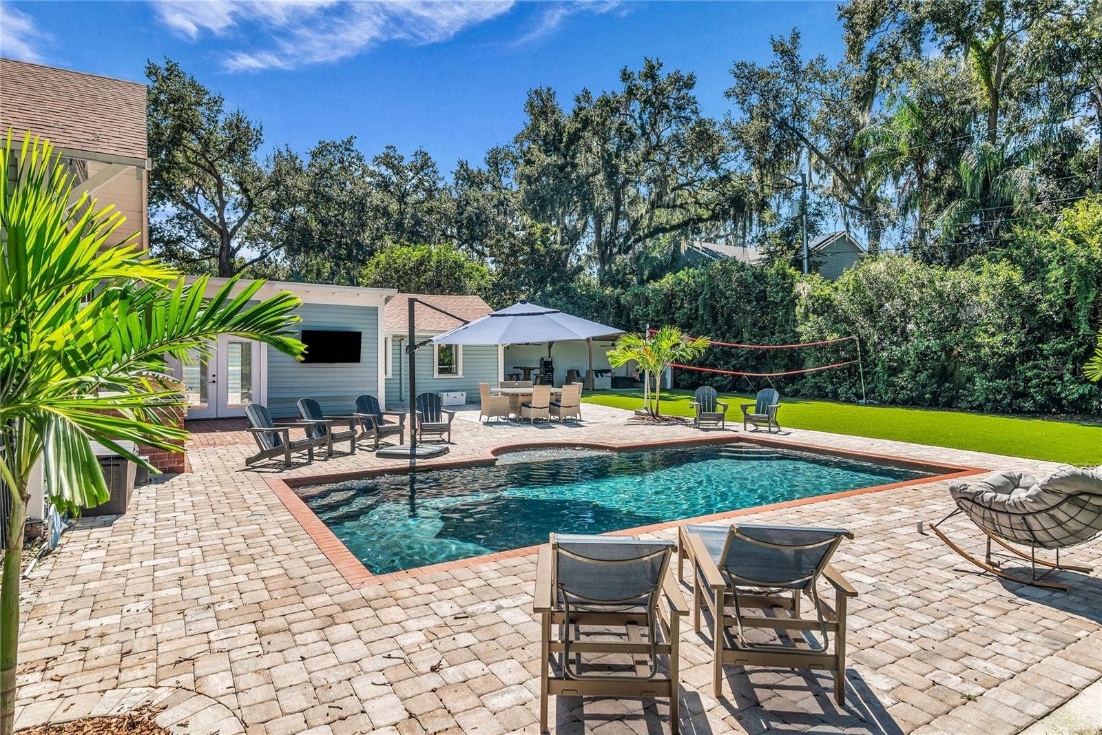 234 N LAKEVIEW AVENUE, Winter Garden, FL 34787 The enormous fully fenced backyard is designed for year-round enjoyment with a gas-heated saltwater sport pool, outdoor kitchen, expansive brick paved deck, detached covered lanai, and low-maintenance turf.