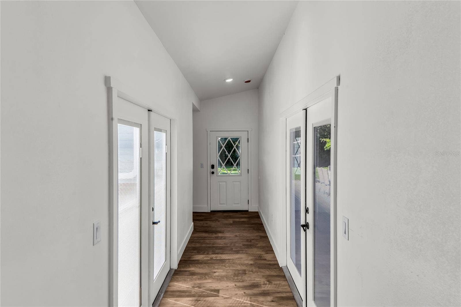234 N LAKEVIEW AVENUE, Winter Garden, FL 34787 Private hallway leads to newly designed Primary Suite. French Doors lead to pool and backyard on one side and private courtyard on opposite side.