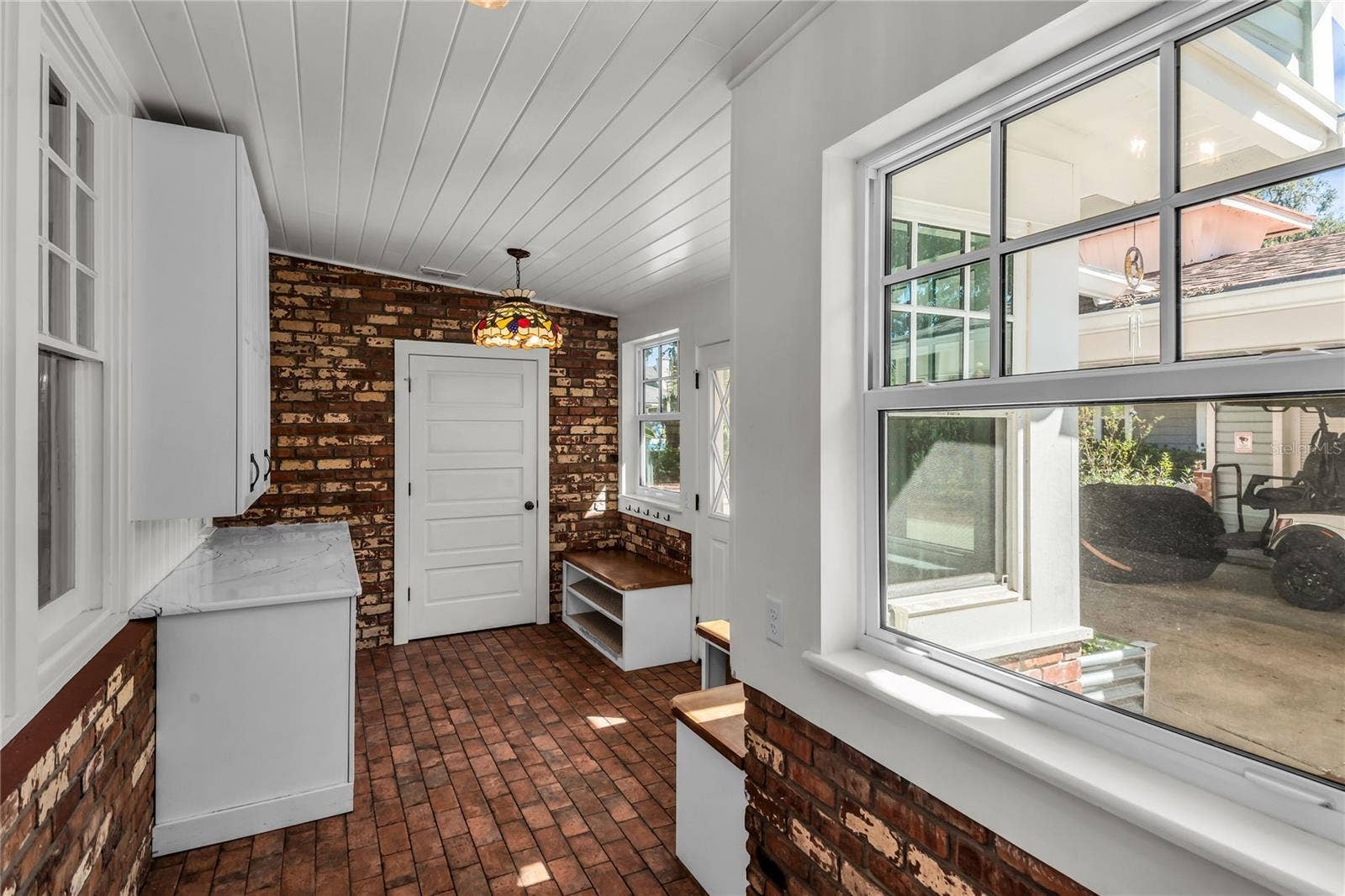 234 N LAKEVIEW AVENUE, Winter Garden, FL 34787 Spacious Mudroom provides entry to carport while a granite countertop, cabinets and a large closet offer both convenience and functionality