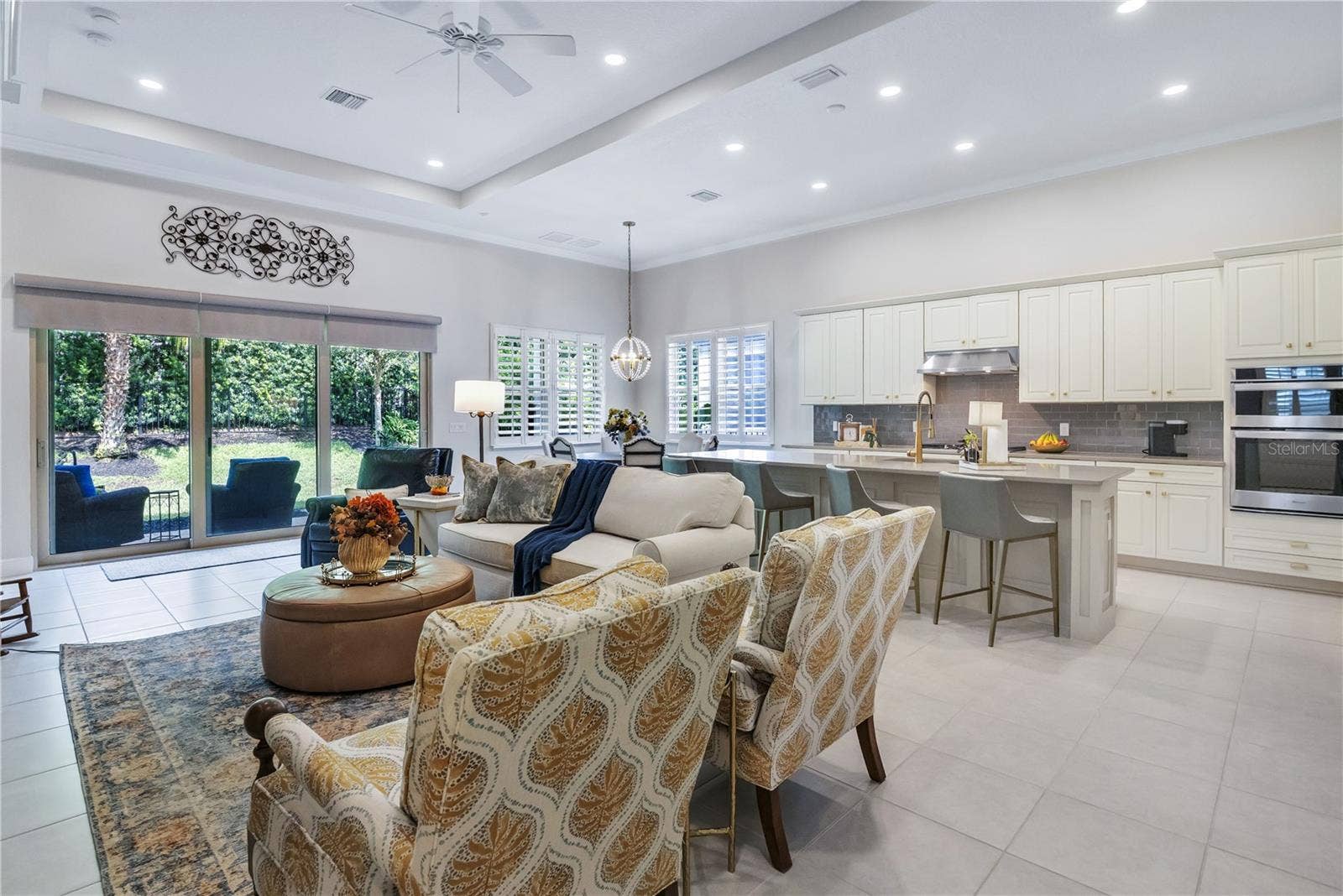15749 CUTTER SAIL PLACE, Winter Garden, FL 34787 Spacious living area with beautiful finishes and abundant natural light.