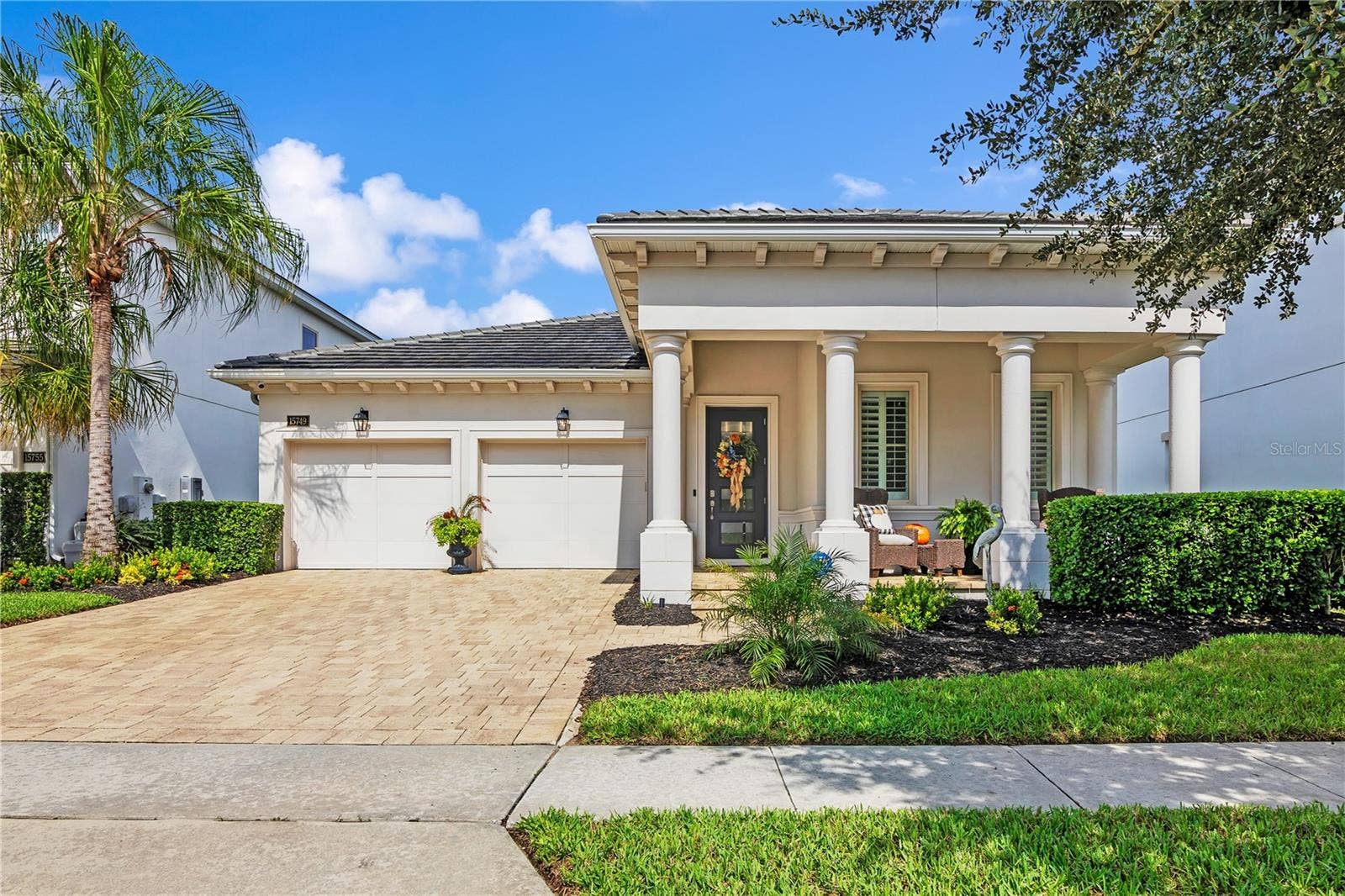 15749 CUTTER SAIL PLACE, Winter Garden, FL 34787 Beautifully designed residence featuring attractive architectural details and inviting curb appeal.
