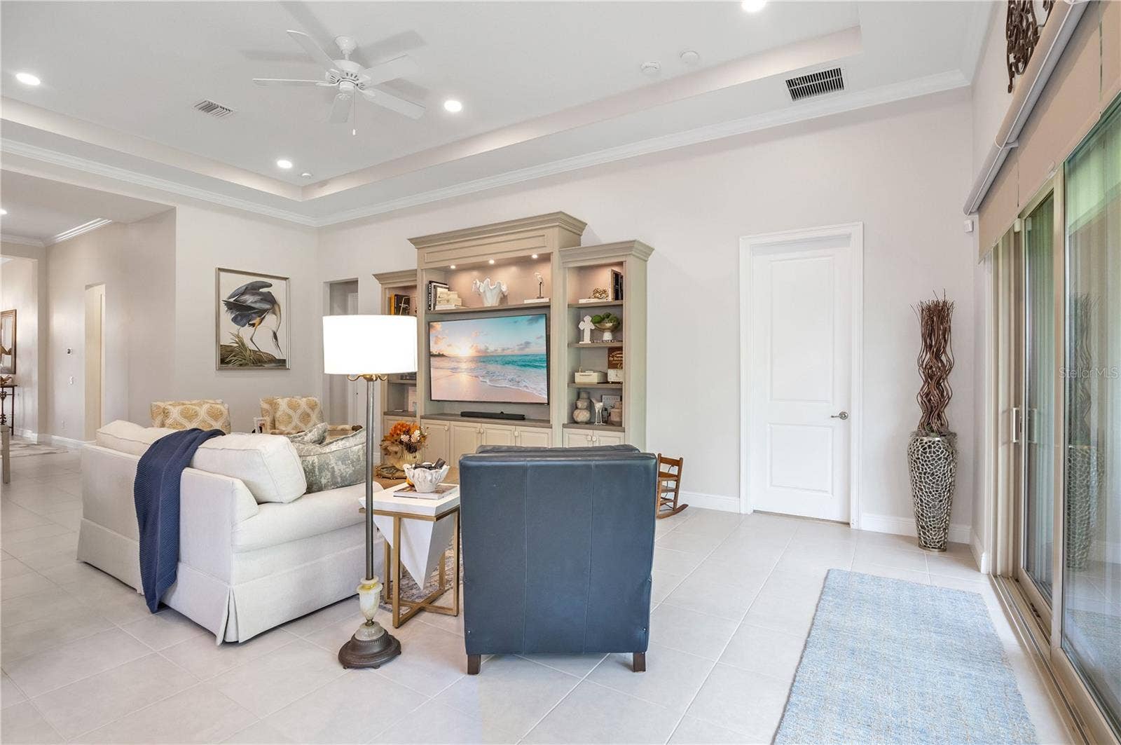 15749 CUTTER SAIL PLACE, Winter Garden, FL 34787 Spacious living area with beautiful finishes and abundant natural light.