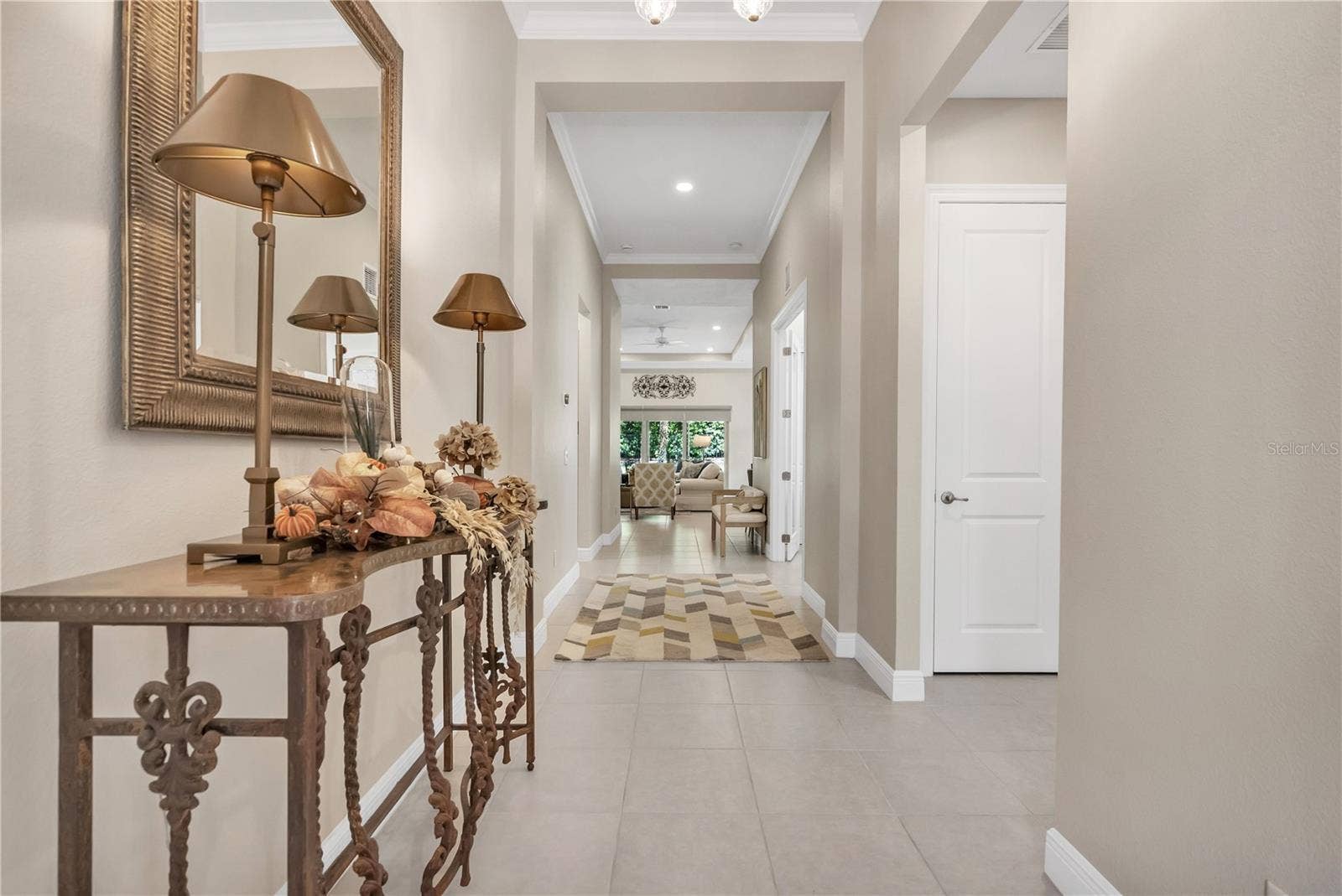 15749 CUTTER SAIL PLACE, Winter Garden, FL 34787 Elegant entryway offering a warm and inviting first impression.