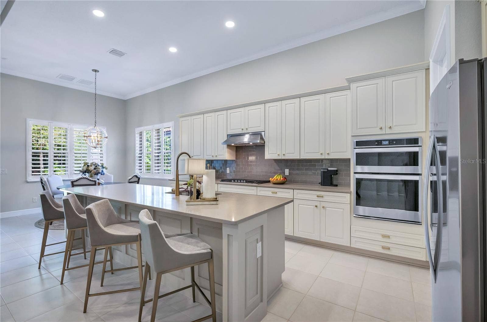 15749 CUTTER SAIL PLACE, Winter Garden, FL 34787 Beautifully appointed kitchen with stylish cabinetry, generous counter space, and an inviting layout.