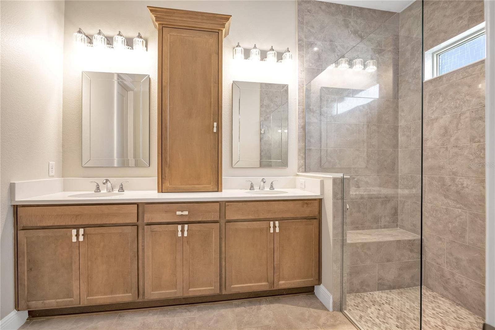 15749 CUTTER SAIL PLACE, Winter Garden, FL 34787 Bright bathroom featuring a contemporary vanity and stylish fixtures.