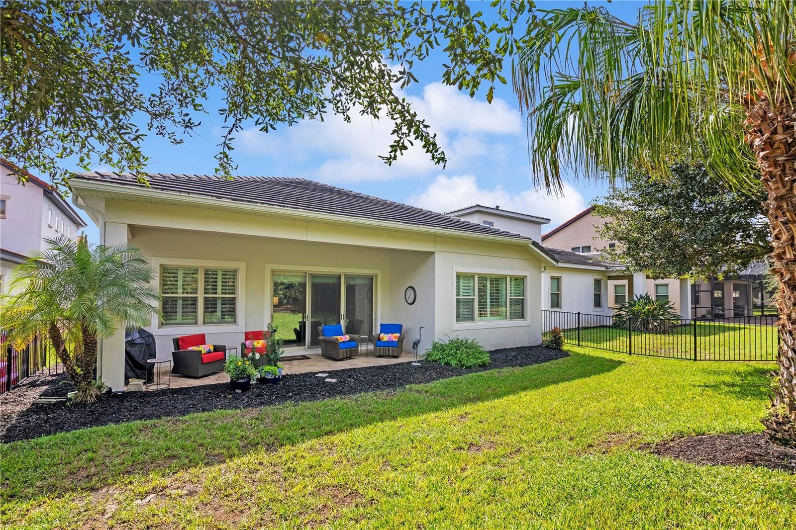 15749 CUTTER SAIL PLACE, Winter Garden, FL 34787 Enjoy Florida living from the covered patio, ideal for outdoor dining and relaxation.