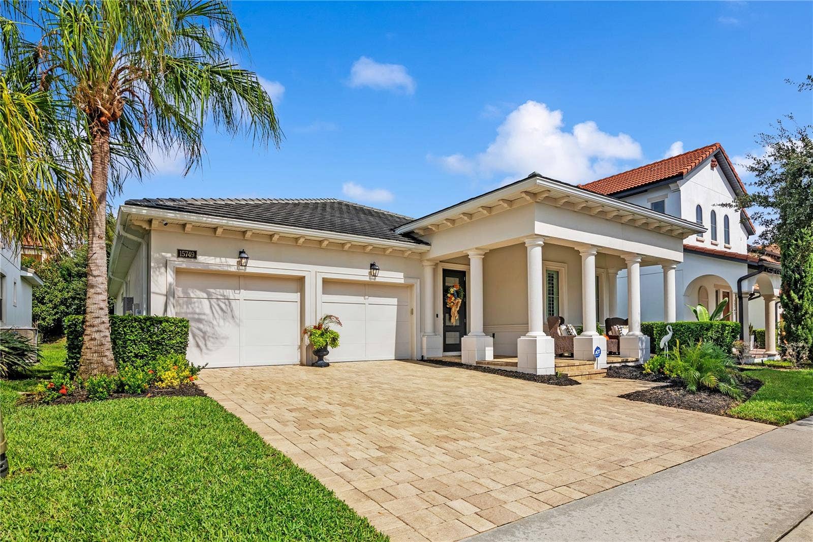 15749 CUTTER SAIL PLACE, Winter Garden, FL 34787 Beautiful curb appeal and timeless architectural details welcome you home.
