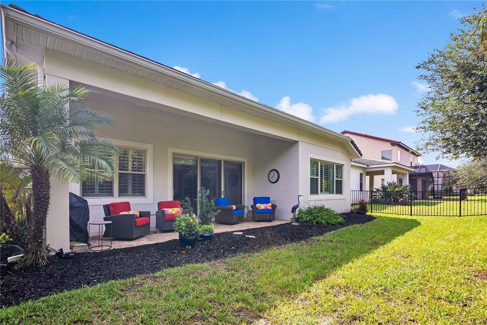 15749 CUTTER SAIL PLACE, Winter Garden, FL 34787 Enjoy Florida living from the covered patio, ideal for outdoor dining and relaxation.