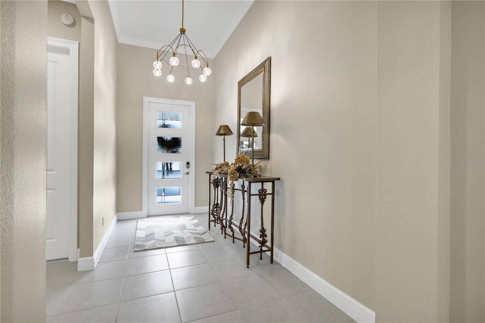 15749 CUTTER SAIL PLACE, Winter Garden, FL 34787 Welcoming entryway with elegant finishes and an inviting atmosphere.