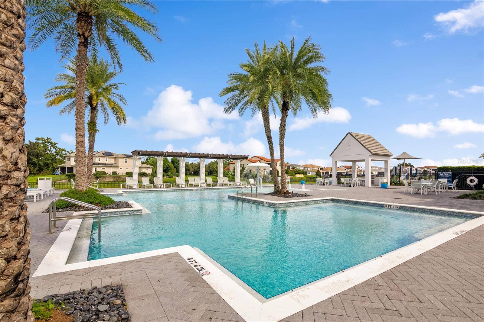 15749 CUTTER SAIL PLACE, Winter Garden, FL 34787 Relax and unwind at the stunning resort-style community pool surrounded by tropical landscaping.