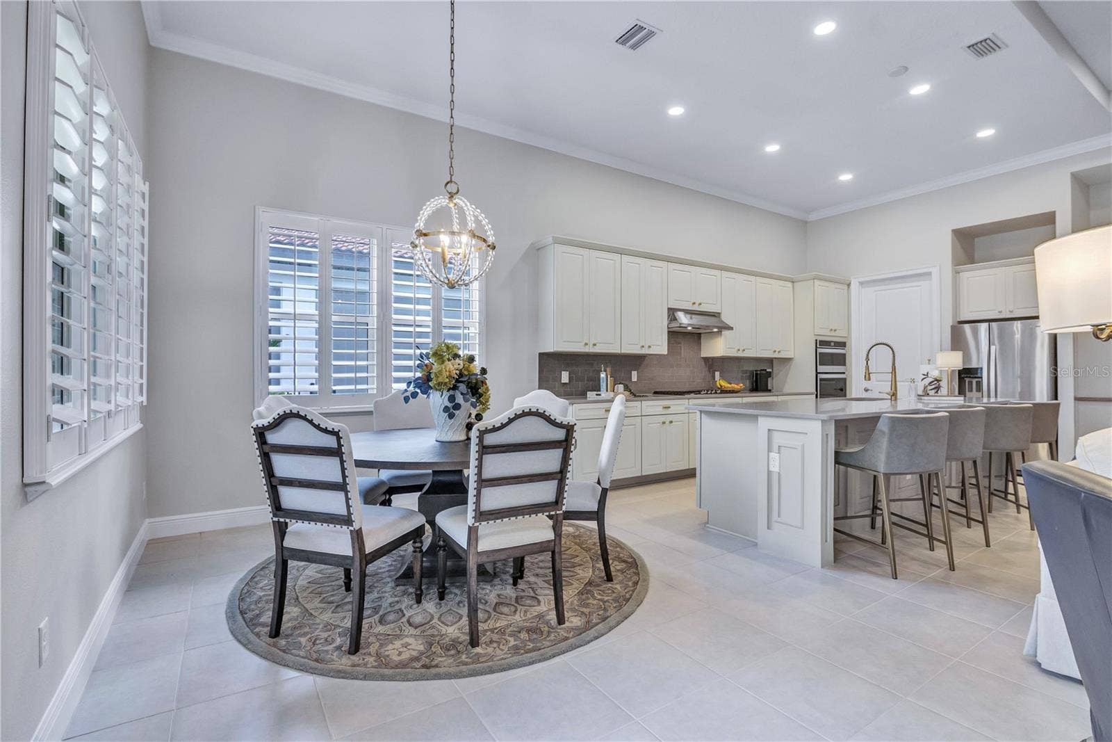 15749 CUTTER SAIL PLACE, Winter Garden, FL 34787 Inviting dining space designed for everyday living and entertaining.